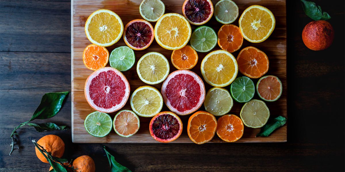 colorful display of limes, oranges, lemons and grapefruit