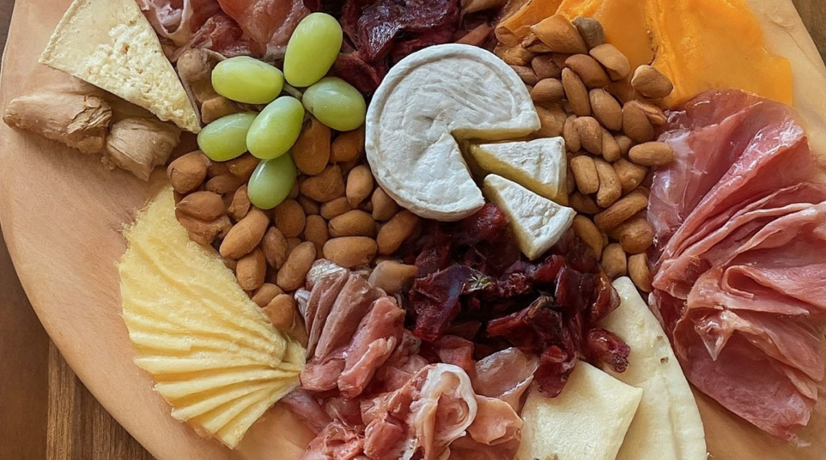 Charcuterie board with cheeses and fruits