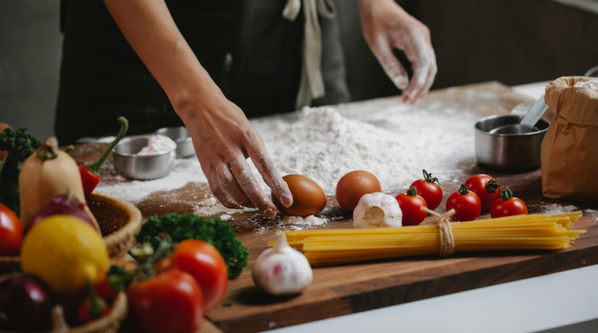 chef, ingredients, tomato, egg, flour on table